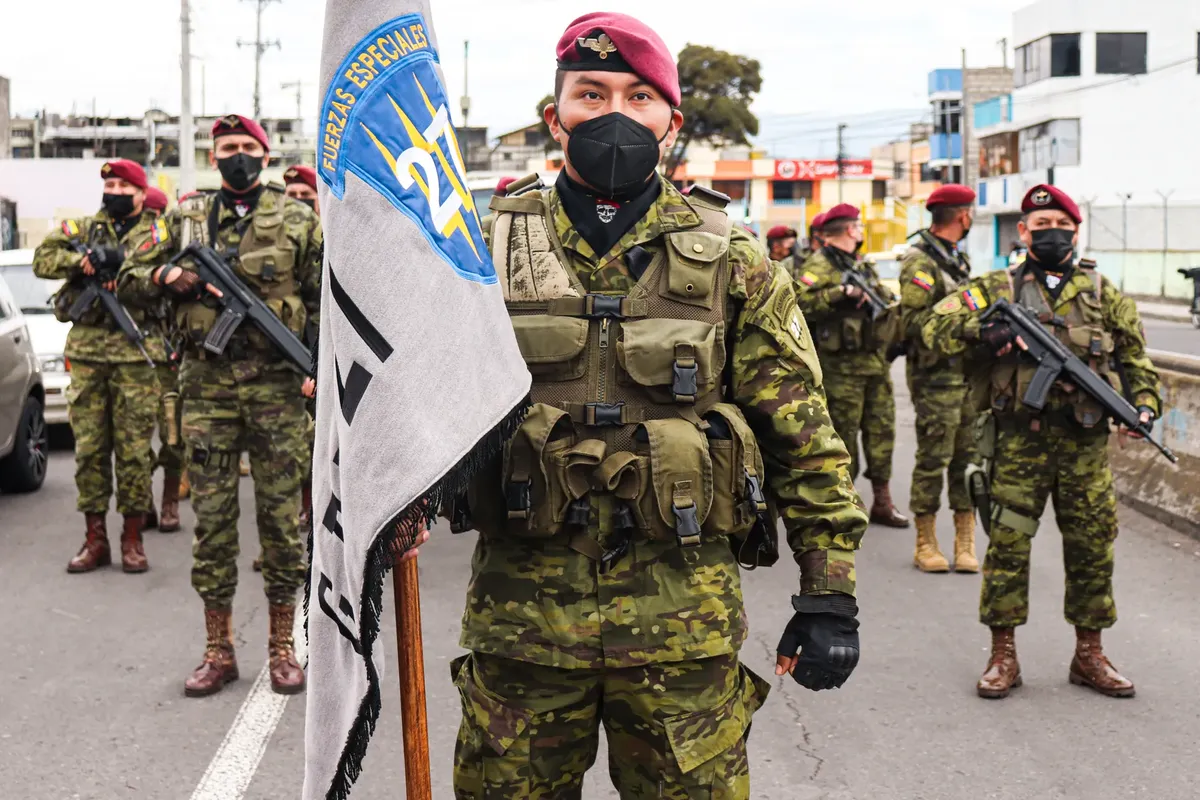 Soldiers in camouflage gear with flags during a parade, Ecuador.
