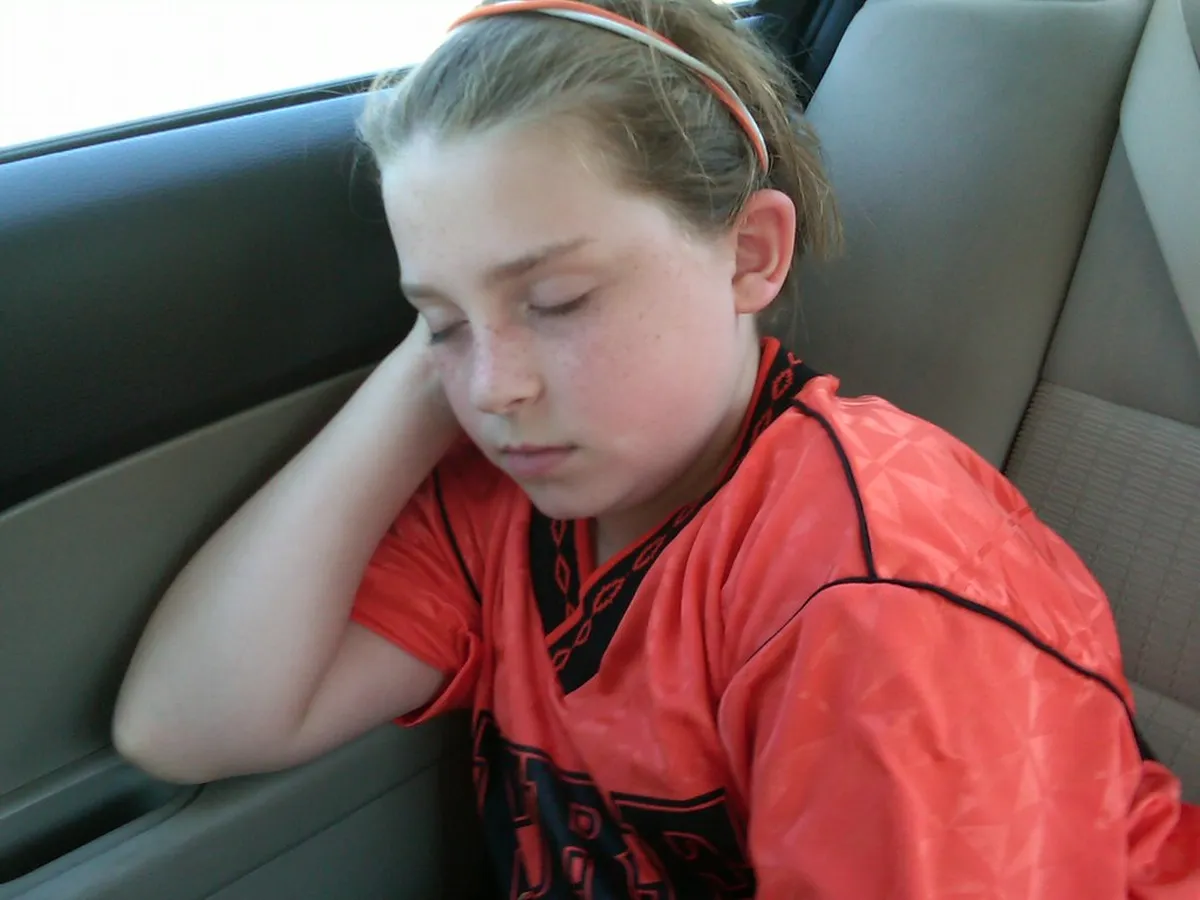 One exhausted little soccer player.